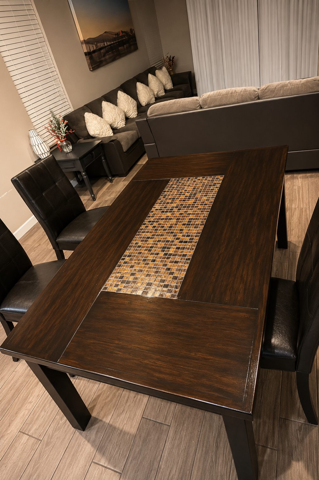 The dining table at Agape Home set beside the living room sofas